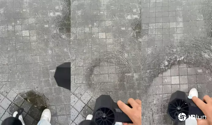 女子暴雨用手提电风扇“分红海”　吹开积水滴水不沾　去年视频再次疯传