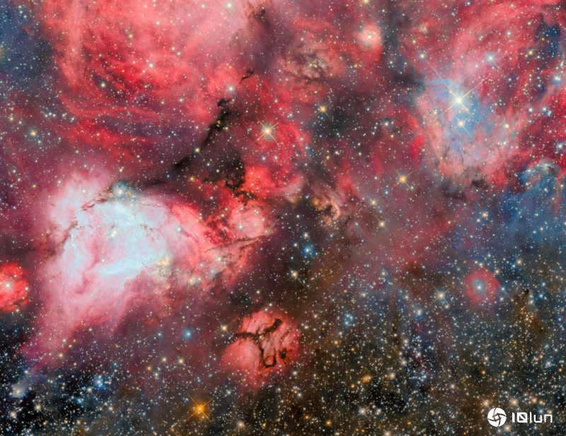 哈勃新形象揭示巨大恒星形成区细节，年轻恒星在黑暗中闪耀炫目光芒